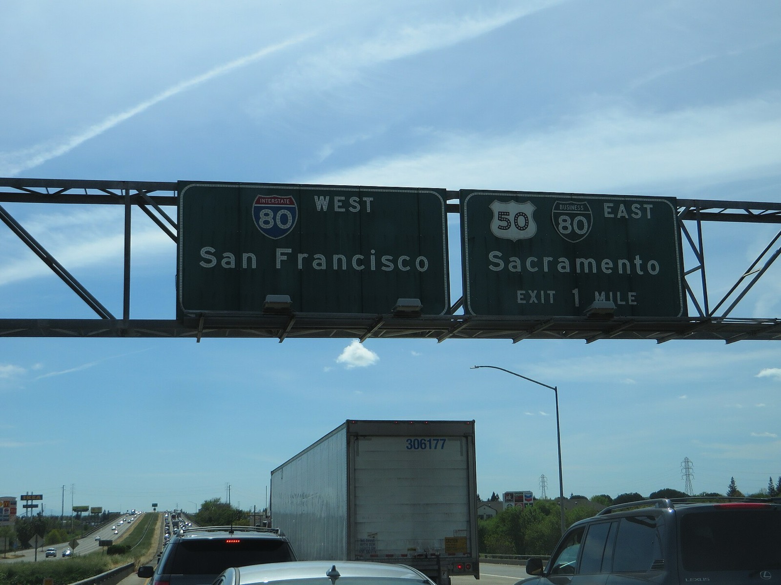 Congested traffic under Interstate 80 signs for San Francisco and Sacramento